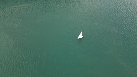 Harmonious-scene-of-yacht-ship-sailing-solo-in-tranquil-Switzerland-lake