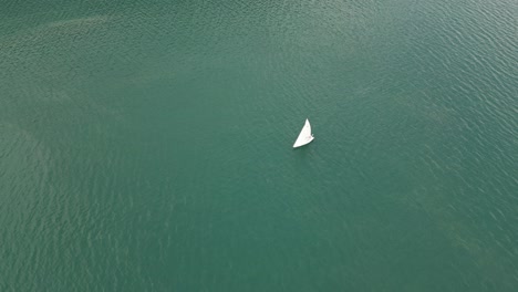 harmonious scene of yacht ship sailing solo in tranquil switzerland lake