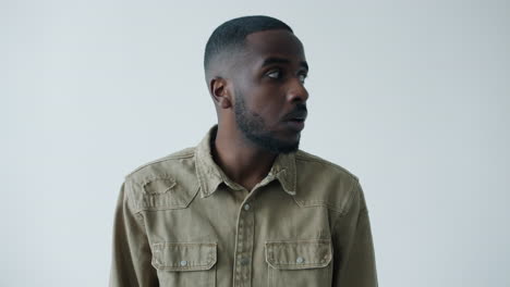 man in khaki shirt profile view