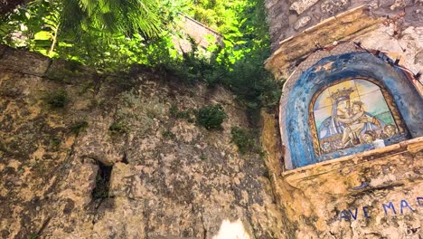 mural of madonna on a stone wall