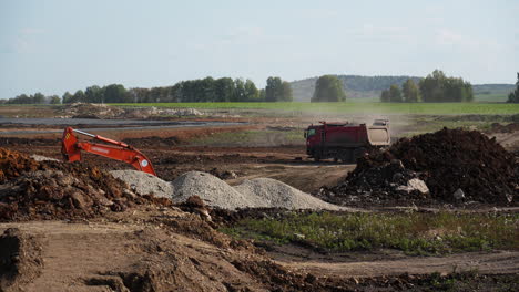 construction site with excavator and dump truck