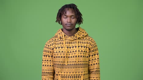 young handsome african man relaxing with eyes closed