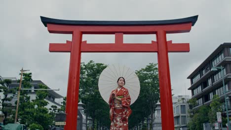 woman in kimono at a torii gate in japan