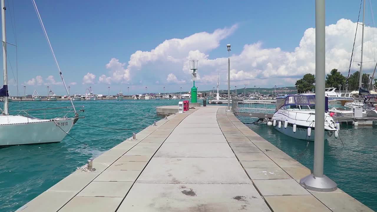 Stunning HD footage of various boats and saliboats docked in Koper's marina in Slovenia
