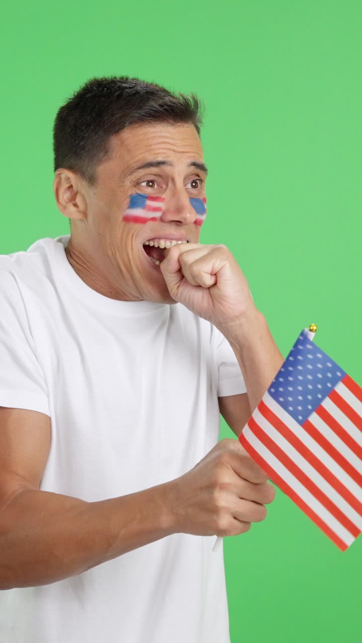 Nervous United States supporter during an exciting match looking away