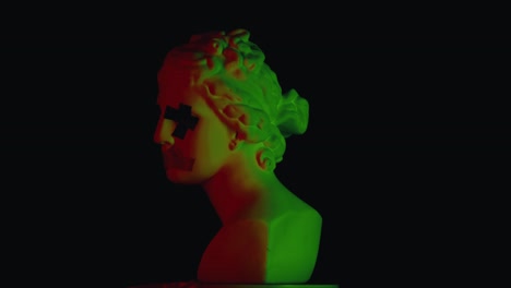 vaporwave aesthetic: classical bust with neon red and green lighting