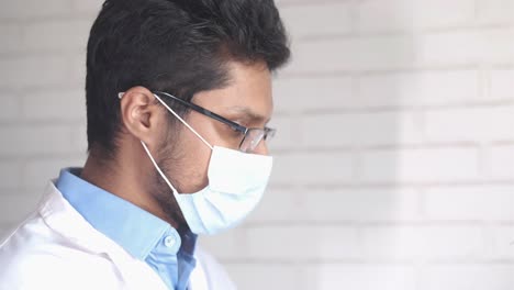 doctor adjusting face mask