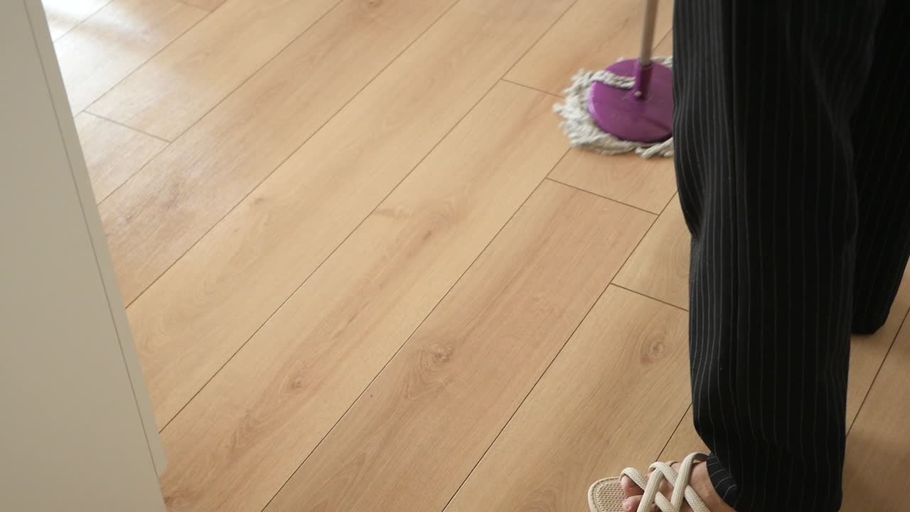 Cleaning a wood floor with a mop