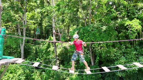 man enjoying a zipline adventure in a forest