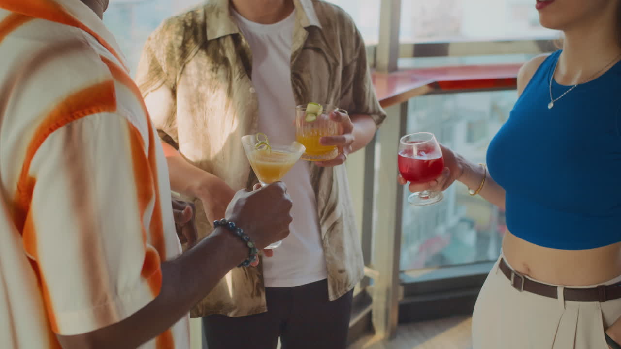 Unrecognizable People Spending Weekend at Bar with Cocktails