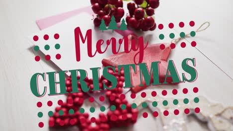 Animation-of-merry-christmas-text-over-christmas-decorations-and-envelopes