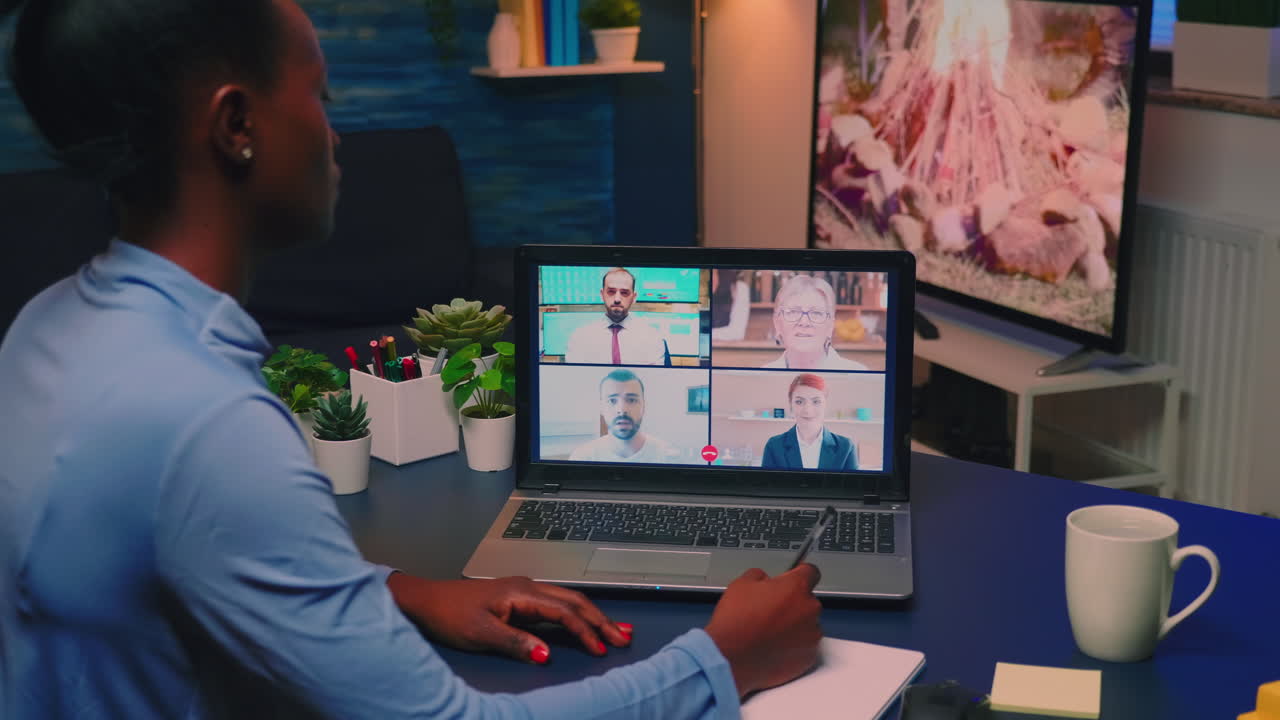 Remote black employee having video conference working from home