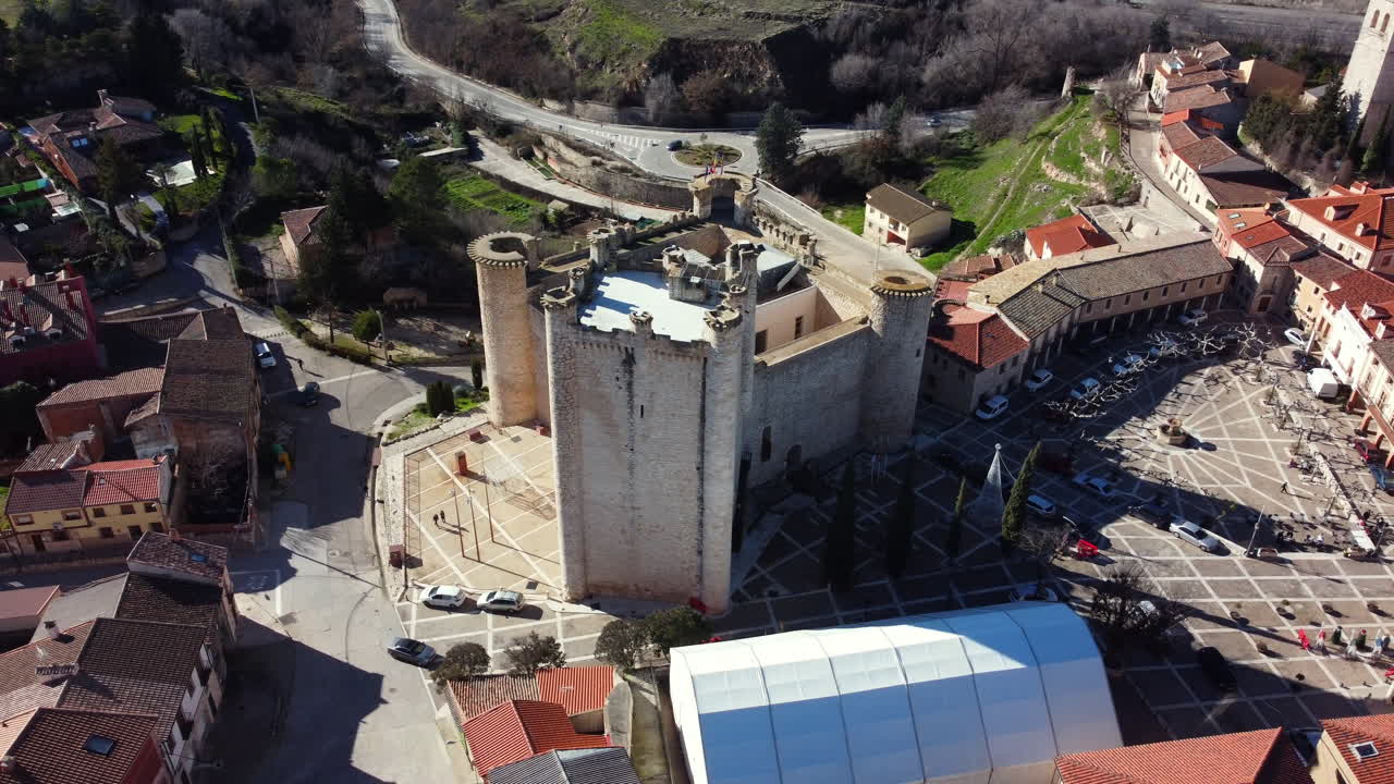 Aerial View of a Medieval Town Square with Castle Tower
