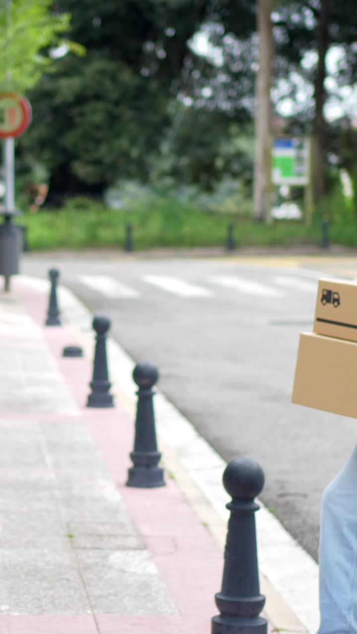 Delivery man handing boxes to a customer