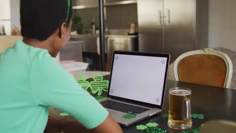 Happy-african-american-woman-making-video-call-using-laptop-with-copy-space