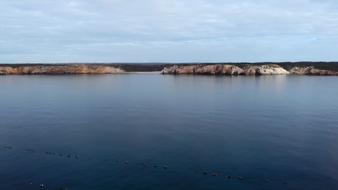 Coastal Landscape with Cliffs and Calm Sea