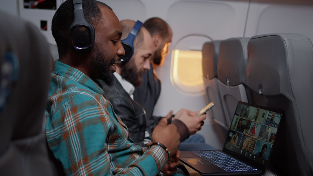 Entrepreneur talking on videocall conference on airplane