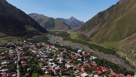 aerial view above terek river in stepantsminda, georgia