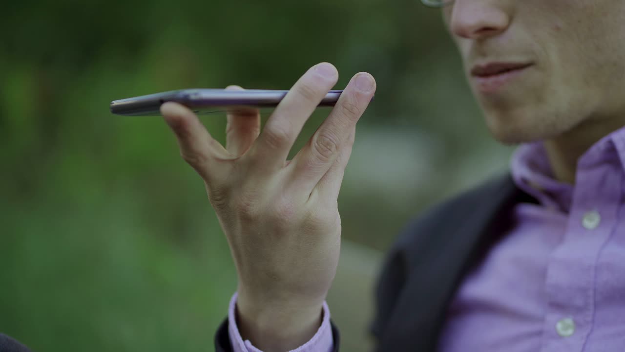 Cropped shot of young man talking on smartphone