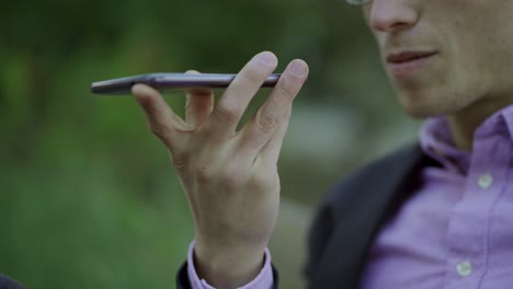 cropped shot of young man talking on smartphone