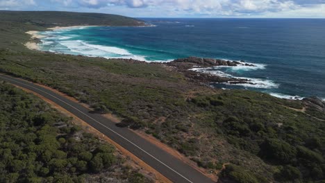 aerial view of scenic coastal road and turquoise ocean