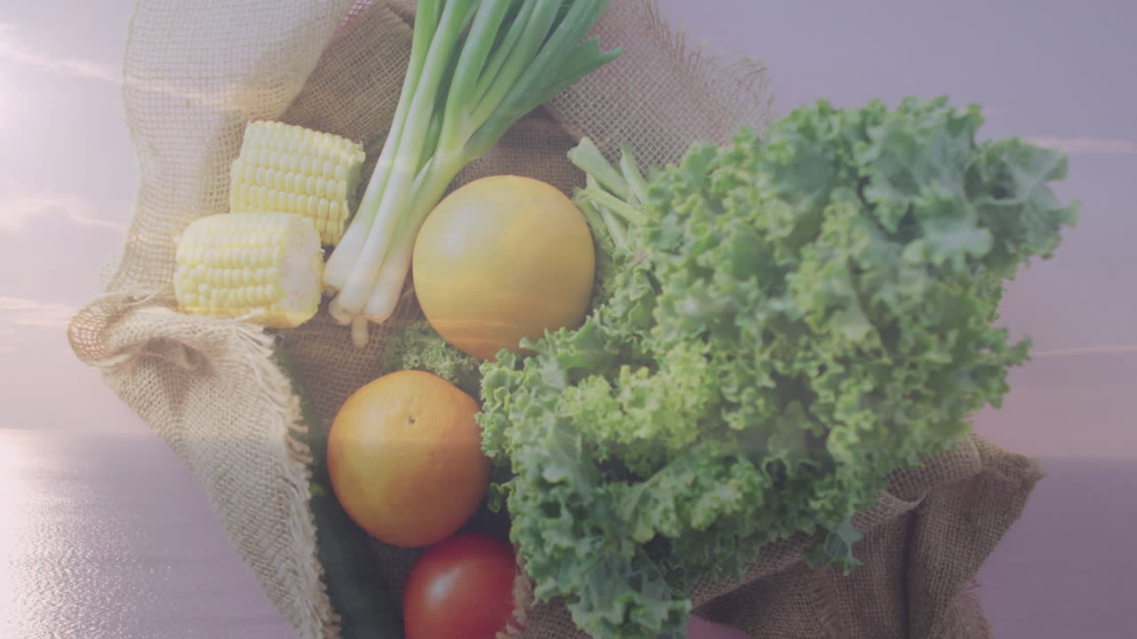 Fresh vegetables like kale, corn, tomatoes in burlap sack with animation