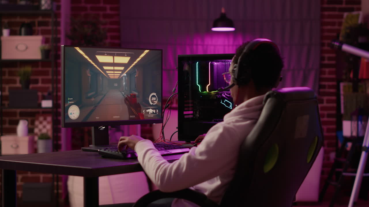 African american gamer having intense experience streaming online first person shooter game on pc station