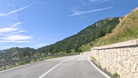 mountain road with scenic views and motorcyclist