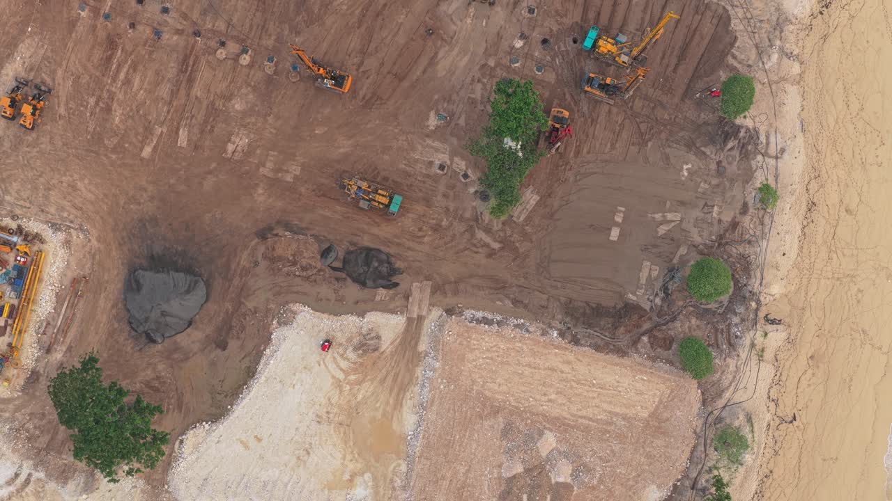 Aerial view of heavy machinery building on nusa dua beach in bali
