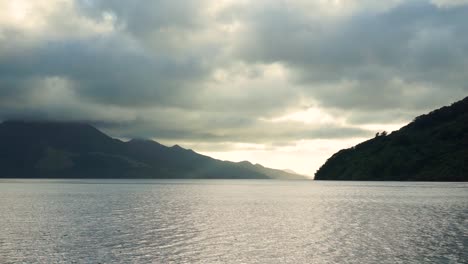 slowmo - beautiful view from boat of ocean, hills and clouds in marlborough sounds, new zealand