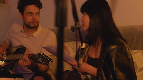 musicians collaborating on songwriting