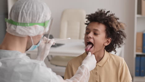 african getting saliva sample collected