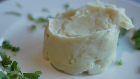 mashed potatoes in bowl on wooden rustic table