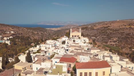 Low-Overhead-Aerial-Drone-Shot-through-the-Village-of-Lefkes-Greece-Revealing-Solar-Panels-on-the-Roofs