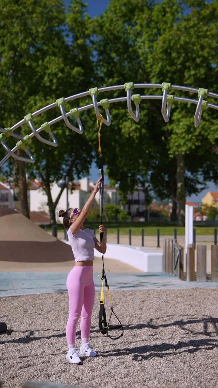 Woman Working Out with Resistance Bands in a Park