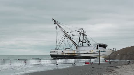 cloudy day with shrimp boat beached