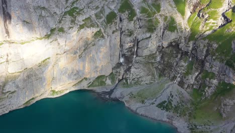 aerial detailed view of the blümisalp mountain and the oeschinen lake, close up of rocky geologic formation switzerland alps