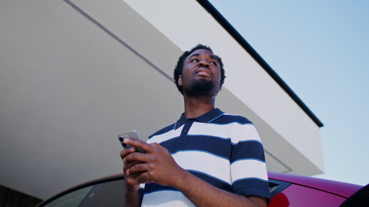 Man using phone at gas station