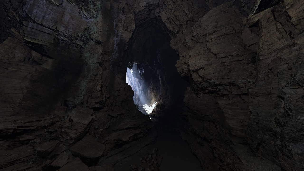 Light pours into a dark cavern revealing stunning rock formations