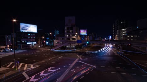 a night timelapse of the traffic jam at the city street in tokyo wide shot