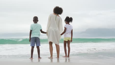 family enjoying free time by the sea