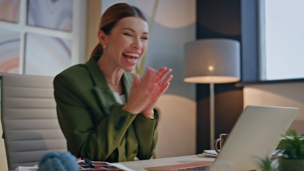 Excited woman clapping hands reading news at laptop closeup. Overjoyed girl