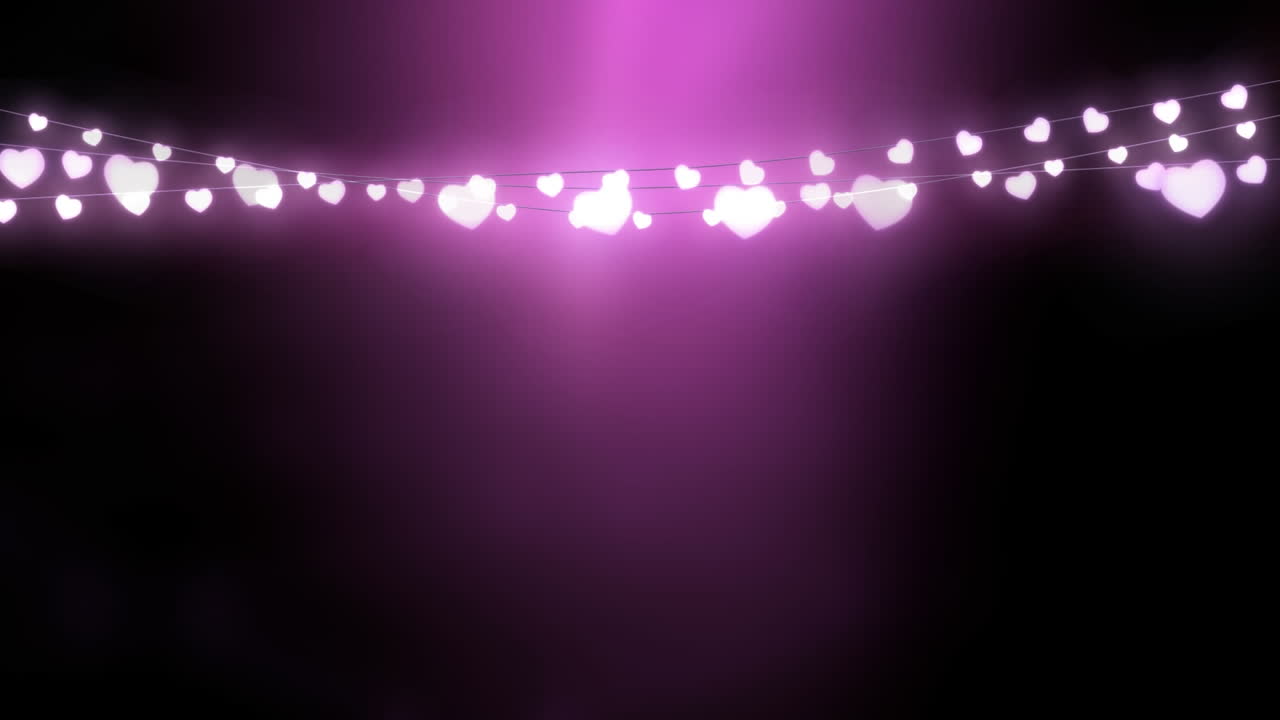Glowing string of fairy lights on pink background