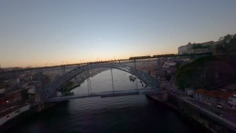 the dom luís i bridge linking porto to vila nova de gaia, portugal, fpv shot