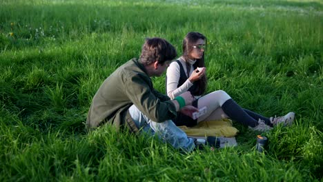 couple having a picnic in a field