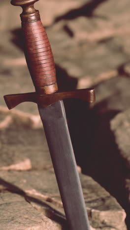 close-up of an ancient dagger on stone