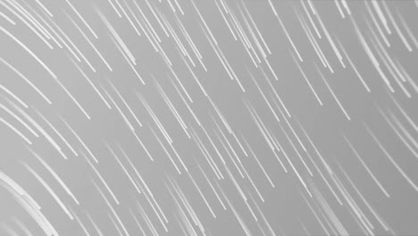 animation of white lines falling on grey background