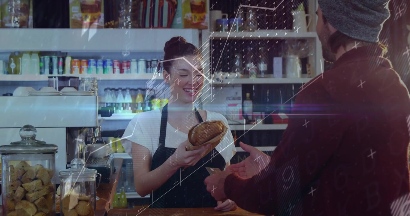 Un cliente si allunga, e il barista prende una pagnotta per servirlo al bancone della panetteria.