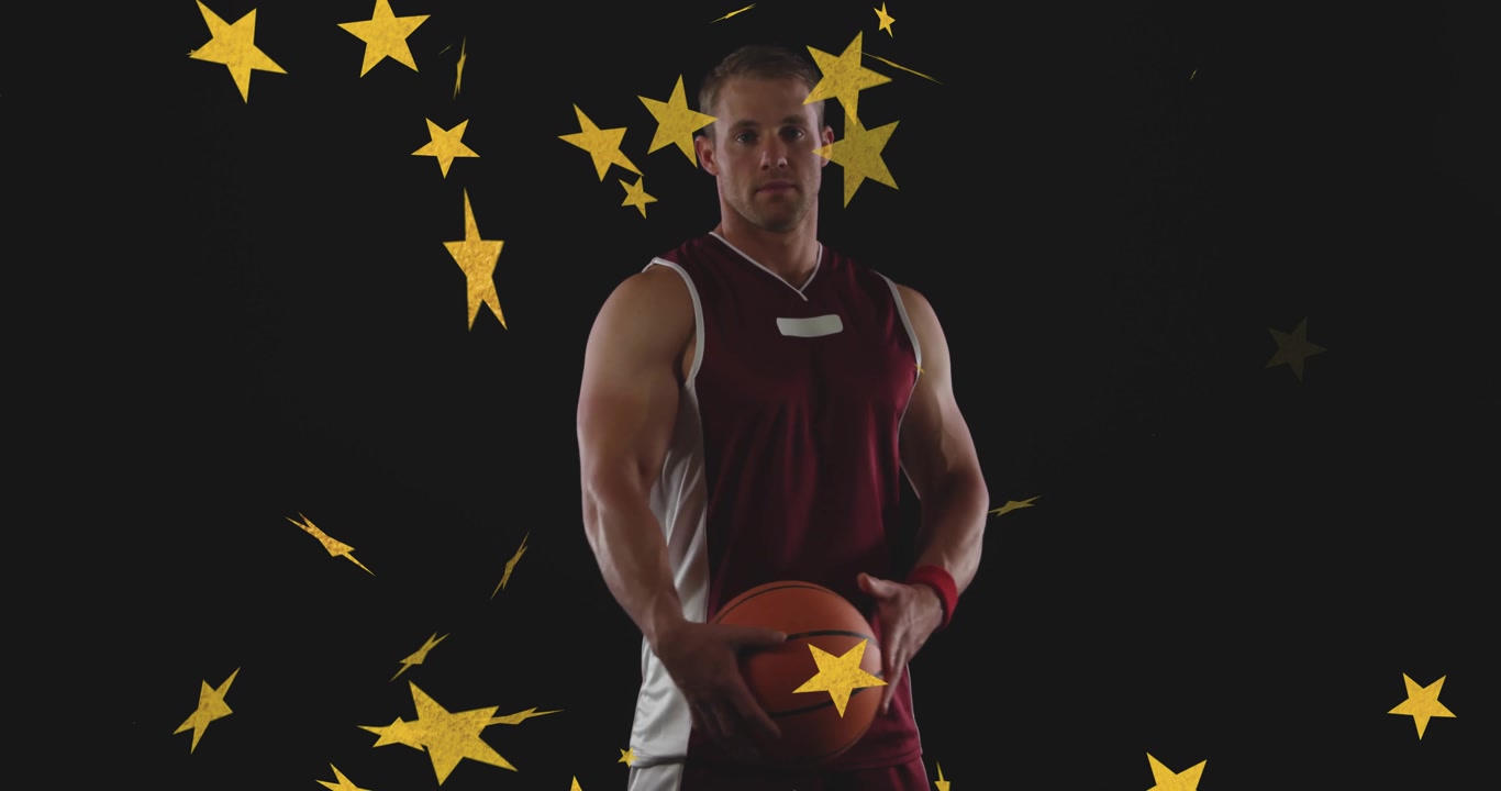 Basketball player gripping ball moving ball up as gold stars cascading for sports intro