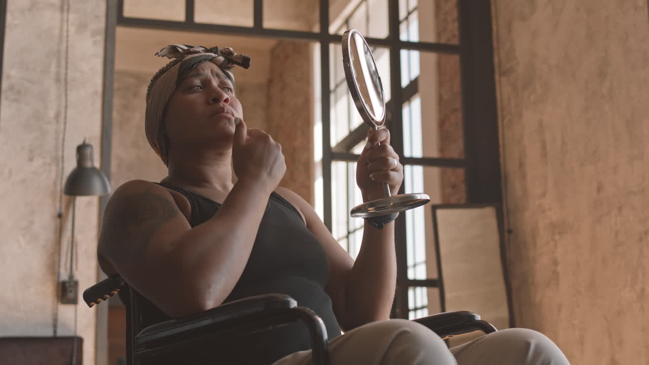 Woman with Disability Looking in Mirror